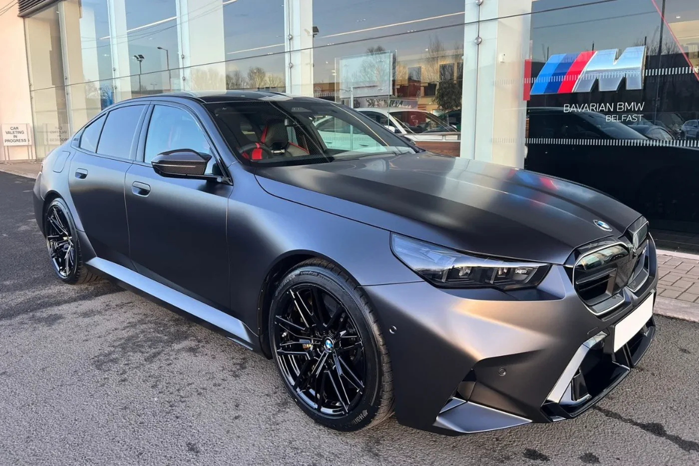 Grey BMW M5 G90 from the Supercar Chauffeur NI fleet
